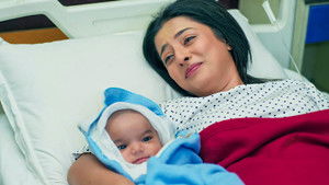 Happiness Blooms with a Newborn