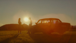 Two drivers at sunset